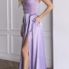 Front view of lavender one-shoulder gown showing beaded mesh draping gathered from waist to shoulder
