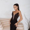 Couture-inspired black evening dress with low waist corset and dramatic 3D floral skirt