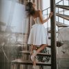 Handmade ivory wedding dress with off-shoulder design and lace-up back